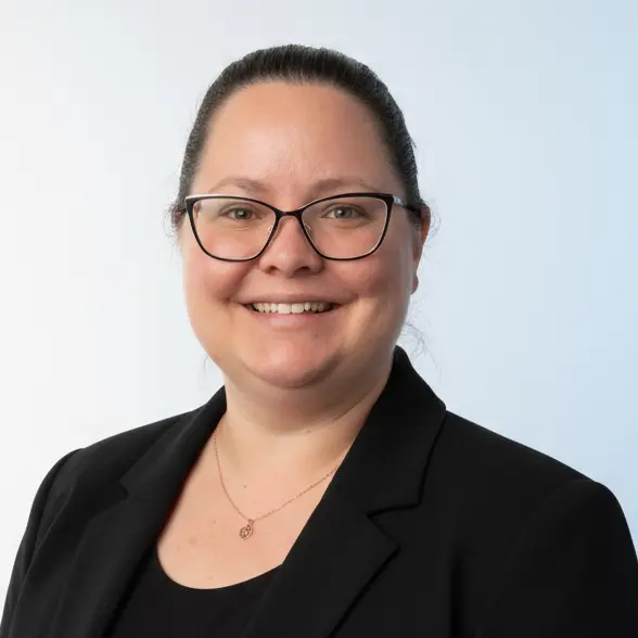 Professional headshot of Gayle Rogers, smiling and wearing business attire against a neutral background.