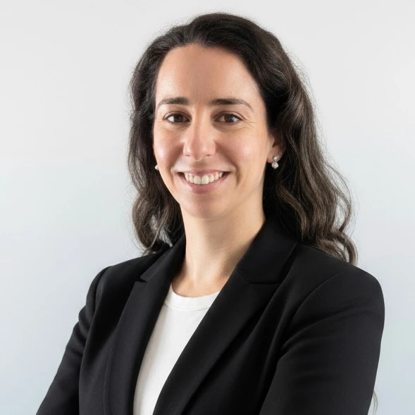 Professional headshot of Jessica Graham, smiling and wearing business attire against a neutral background.