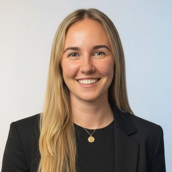Professional headshot of Louise Condon, smiling and wearing business attire against a neutral background.
